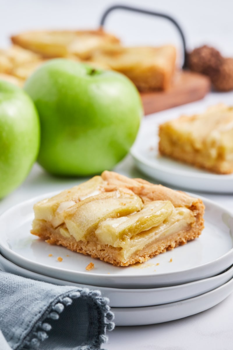 piece of caramelized apple tart on white plate