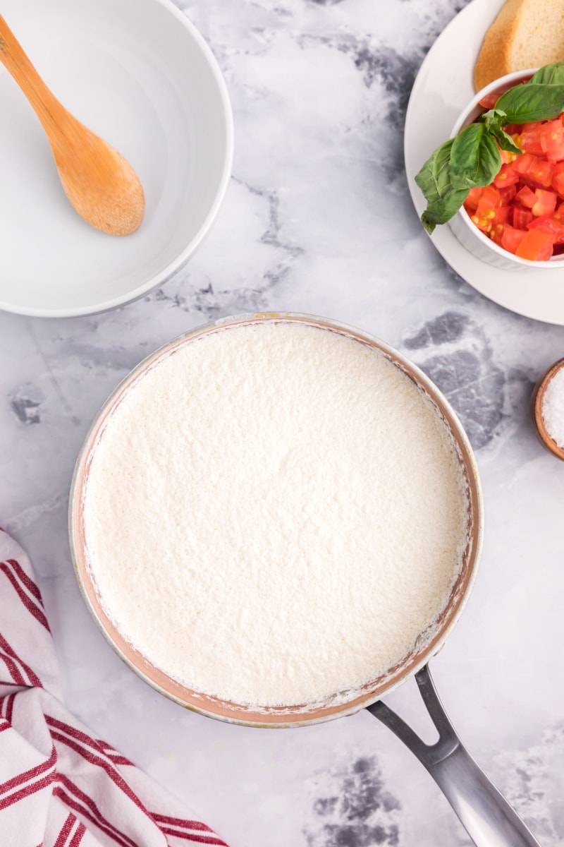 liquids heating in pan to make ricotta cheese