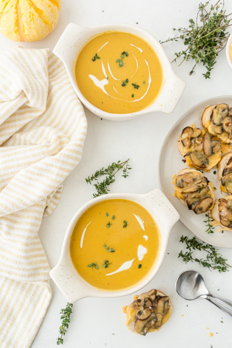 two bowls of roasted pumpkin bisque