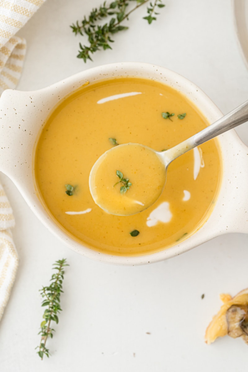 roasted pumpkin bisque in a bowl with a spoon