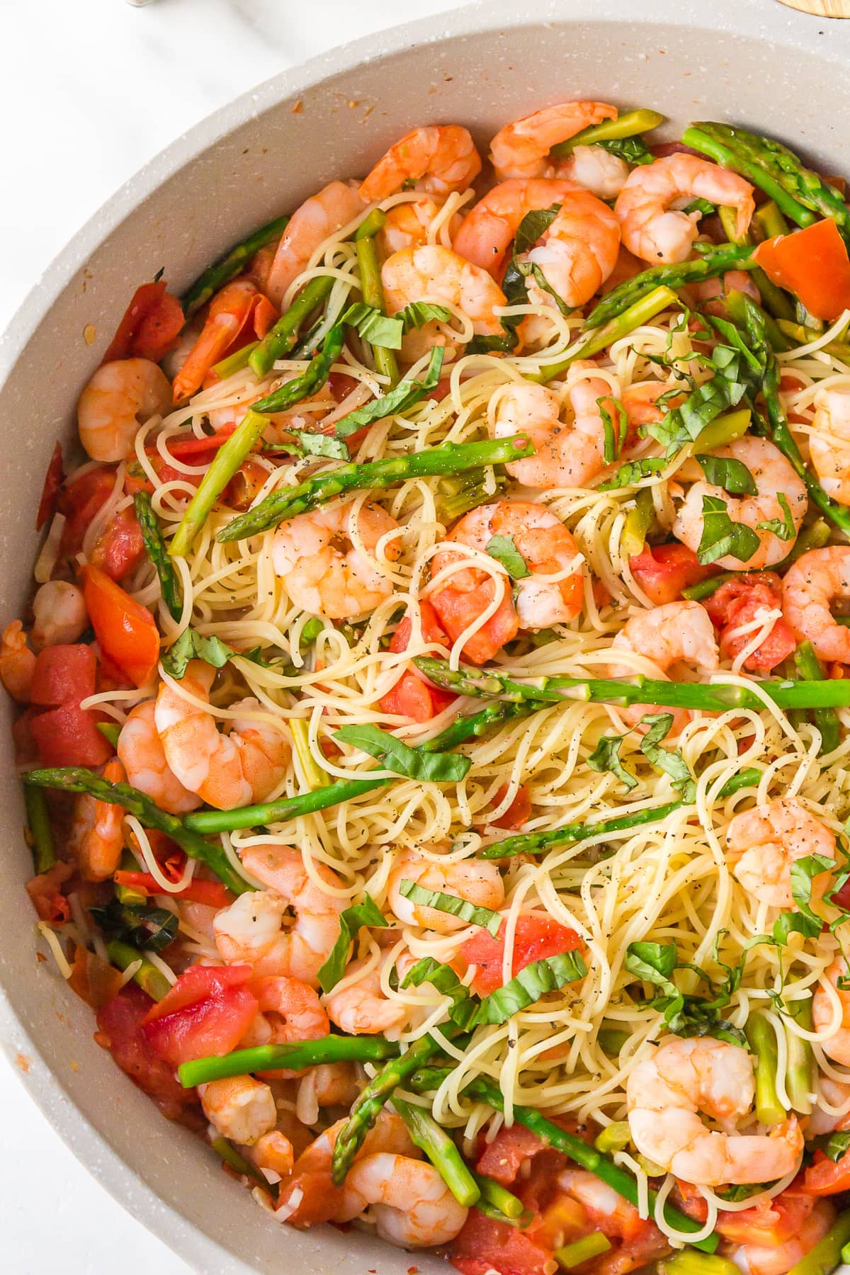 angel hair pasta with shrimp in pan