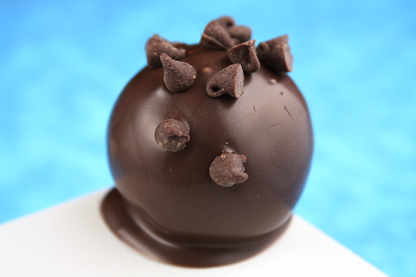 Chocolate Chip Cookie Dough Truffles dipped in chocolate and covered with Chocolate Chips