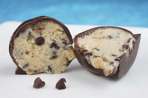 Chocolate Chip Cookie Dough Truffles recipe from RecipeGirl.com #chocolatechip #cookiedough #truffles #recipe #RecipeGirl Chocolate Chip Cookie Dough Truffle cut in half