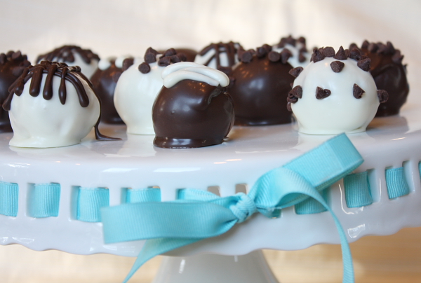 Chocolate Chip Cookie Dough Truffles on a white platter with a blue ribbon
