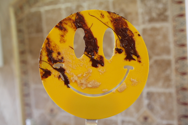 Smiley Face Spatula with chocolate on it