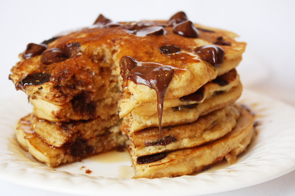 stack of chocolate chip pancakes with piece cut out