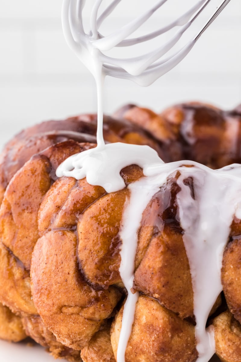pouring icing onto monkey bread