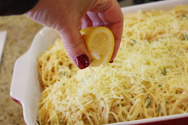 Baked Lemon Spaghetti 15 squeezing lemon onto pasta in dish