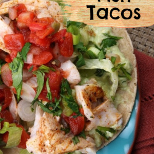 broiled fish tacos on a blue plate