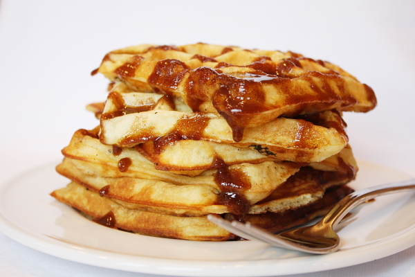 stack of waffles with cinnamon topping