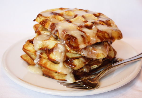 stack of Cinnamon Roll Waffles with Cream Cheese Glaze