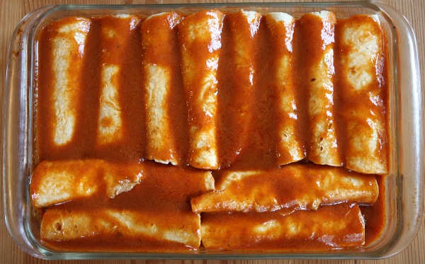 beef enchiladas in a casserole dish ready for the oven