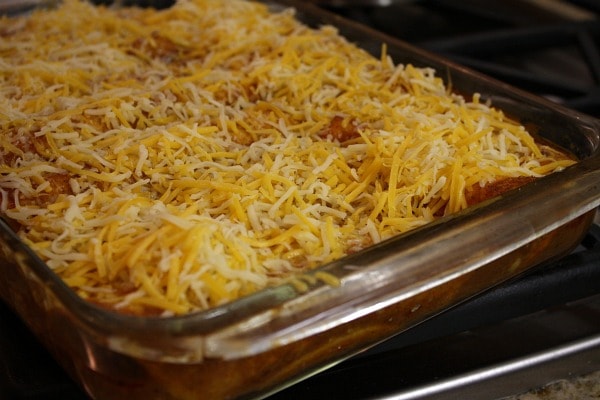 beef enchiladas in a casserole dish ready for the oven