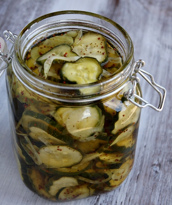 an open jar of bread and butter pickles
