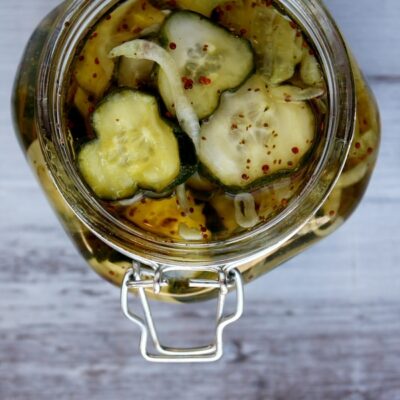 overhead shot into a jar of bread and butter pickles