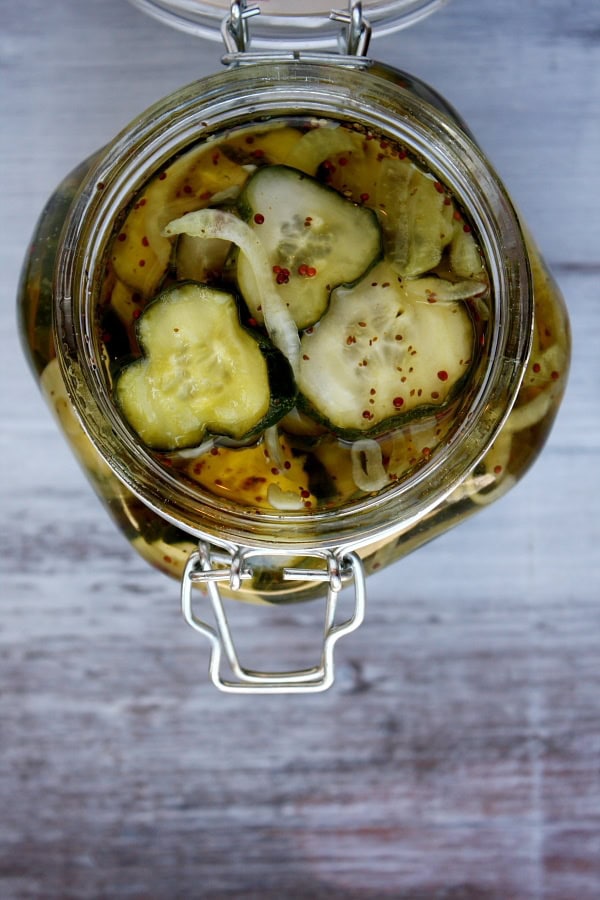 overhead shot into a jar of bread and butter pickles