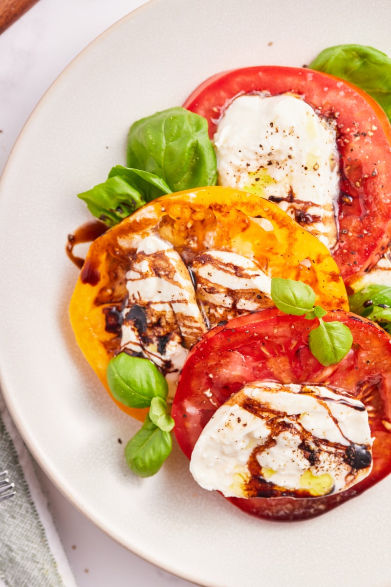 close up caprese salad with burrata cheese