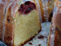 cherry limeade pound cake set on a blue and white patterned plate, cut open to see the inside