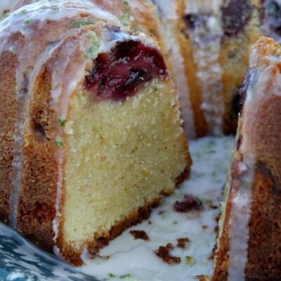 cherry limeade pound cake set on a blue and white patterned plate, cut open to see the inside