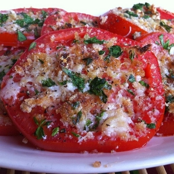 Tomato slices with Asiago cheese and fresh herbs