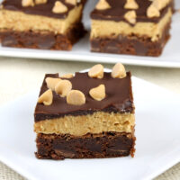 peanut butter cookie dough brownie on white plate with more in the background