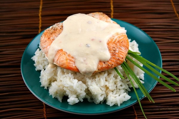 salmon fillet over rice topped with coconut ginger sauce