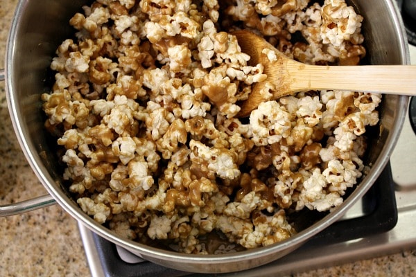 How to Make Caramel Corn : stir the caramel into the popcorn