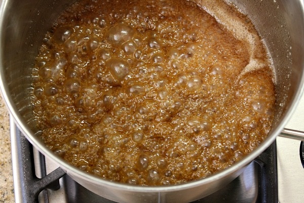 How to Make Caramel Corn : bring sugar to boil, then simmer