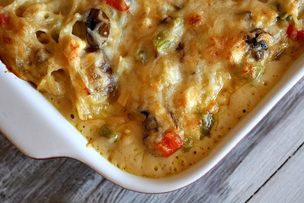 chicken spaghetti casserole in a white casserole dish