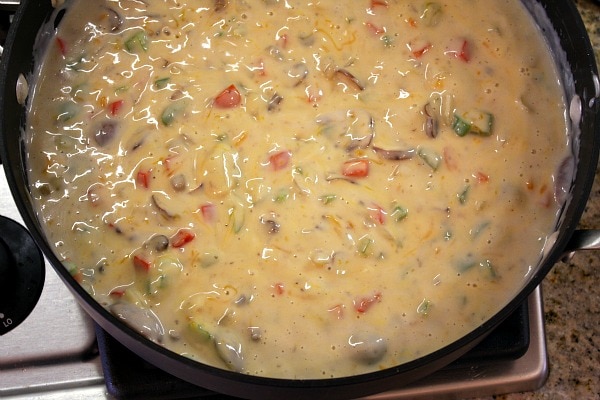 Chicken Spaghetti Casserole recipe from RecipeGirl.com #chicken #spaghetti #casserole #recipe #RecipeGirl sauce in a skillet for chicken spaghetti casserole
