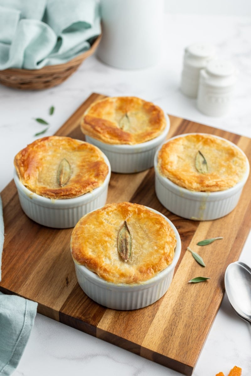 mini chicken pot pies on a board