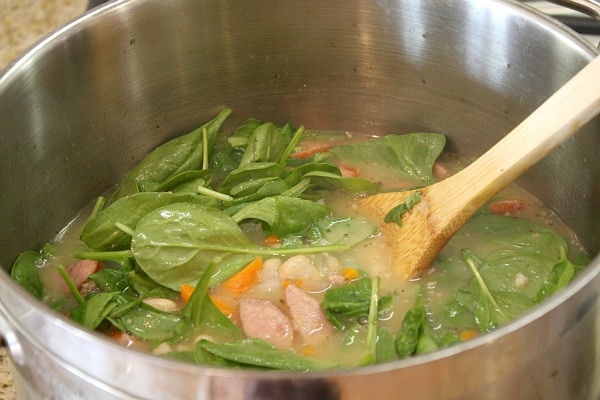 making a pot of Bean and Sausage Soup 