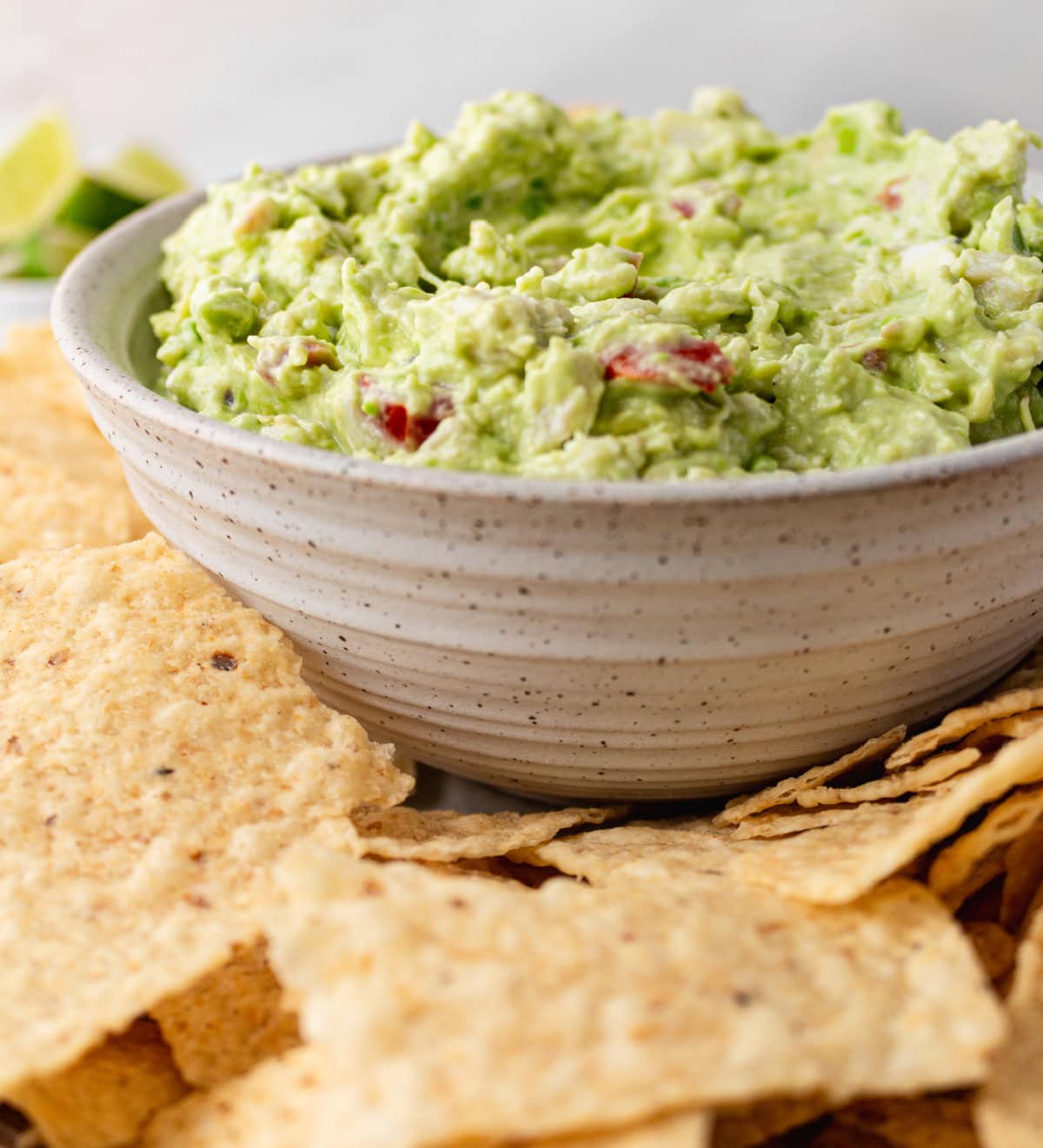 Crab Guacamole is a creamy, fresh twist on classic guacamole with avocado, crab and lime. Easy and perfect for entertaining! bowl of crab guacamole