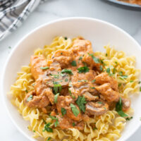 bowl of chicken stroganoff over egg noodles