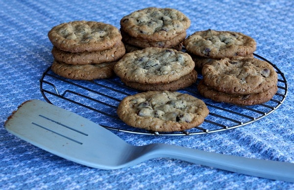 cookies piled on a cooling  rack