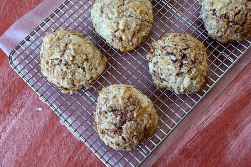 cinnamon bun scones cooling on a rack