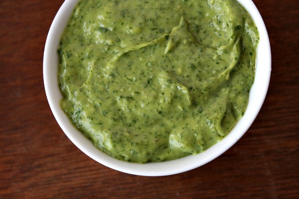 green chimichurri sauce in a white bowl