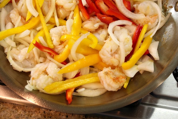 shrimp and bell peppers in a pan