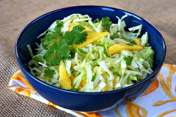 Mango Slaw recipe from RecipeGirl.com #mango #slaw #recipe #RecipeGirl Mango Slaw in blue bowl