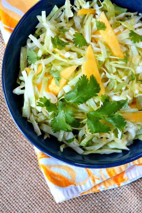 Mango Slaw recipe from RecipeGirl.com #mango #slaw #recipe #RecipeGirl Mango Slaw in blue bowl