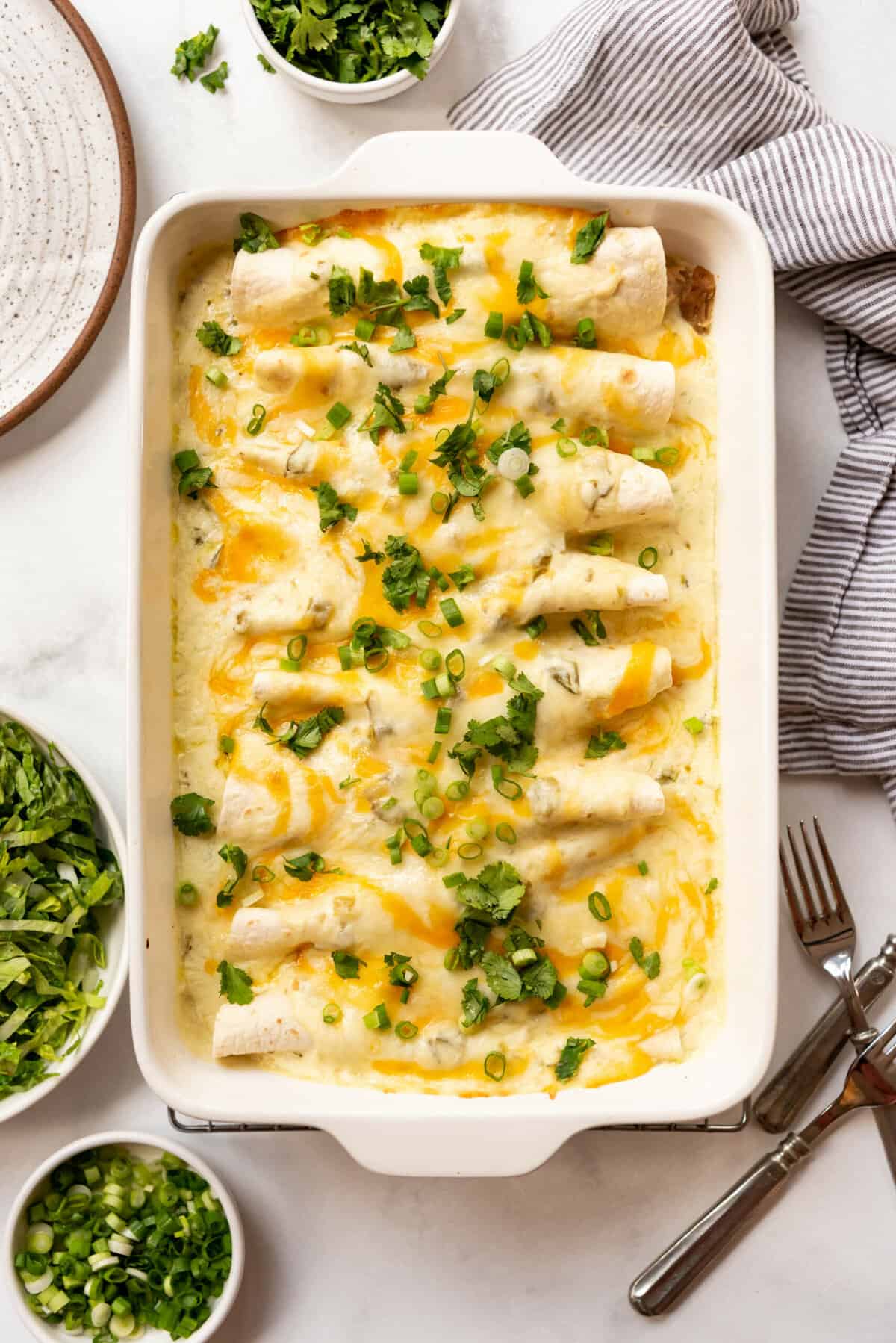 white chicken enchiladas in the pan