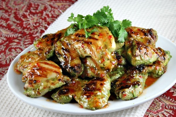 Easy Grilled Cilantro Chicken recipe from RecipeGirl.com #easy #grilled #cilantro #chicken #thighs #recipe #RecipeGirl Cilantro Chicken on white platter