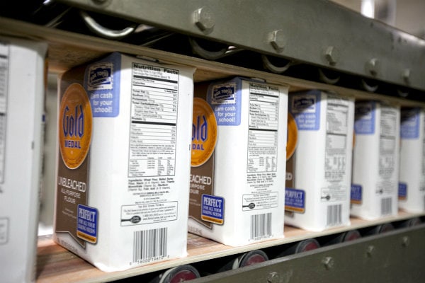 bags of gold medal flour being processed