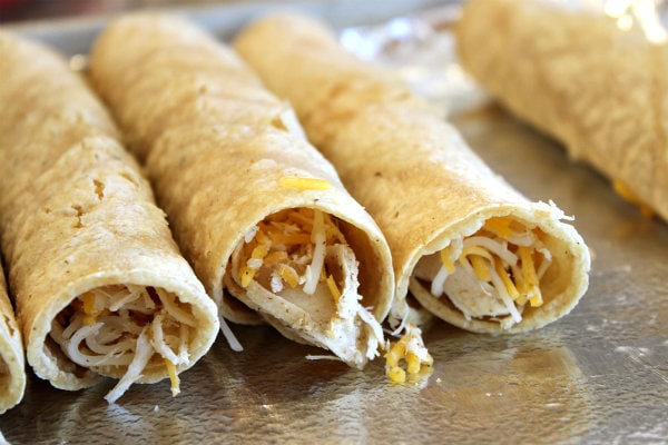 Chicken Taquitos on a baking sheet ready for the oven