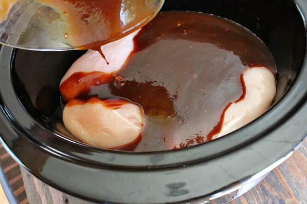 Slow Cooker Pulled Barbecued Chicken Sandwiches recipe from RecipeGirl.com #slow #cooker #slowcooker #crockpot #pulled #bbq #barbecue #barbecued #chicken #sandwiches #recipe #RecipeGirl Making Pulled Barbecued Chicken in a slow cooker