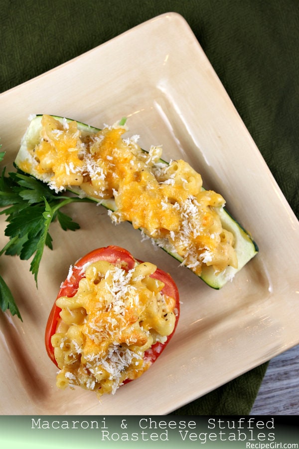 Macaroni and Cheese Stuffed Roasted Vegetables 2 macaroni and cheese stuffed vegetables on plate
