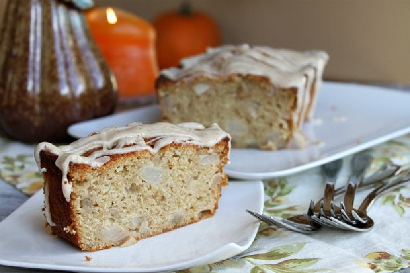 spiced pear cake cut open on plates