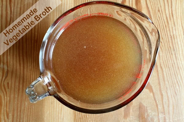 Homemade Vegetable Broth in a measuring cup