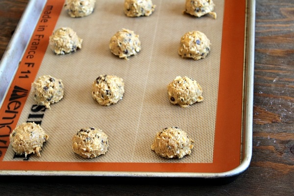 Pumpkin Oatmeal Candy Bar Cookies recipe from RecipeGirl.com #pumpkin #oatmeal #candy #candybar #chocolate #cookies #recipe #RecipeGirl cookie dough on baking sheet ready for oven