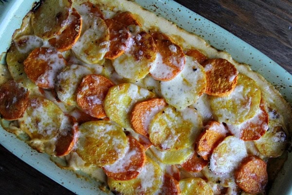 Pumpkin Scalloped Potatoes recipe from RecipeGirl.com #pumpkin #scalloped #potatoes #recipe #RecipeGirl Pumpkin Scalloped Potatoes in a baking dish